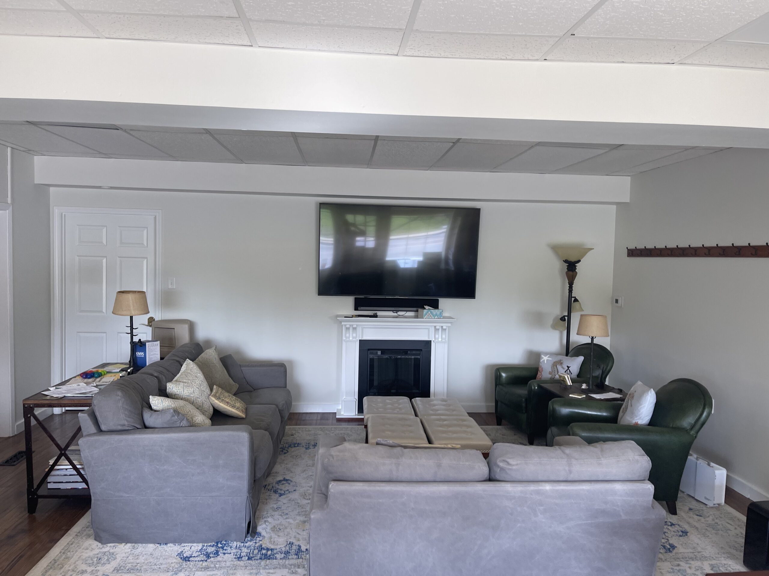 A living room with couches and a television.