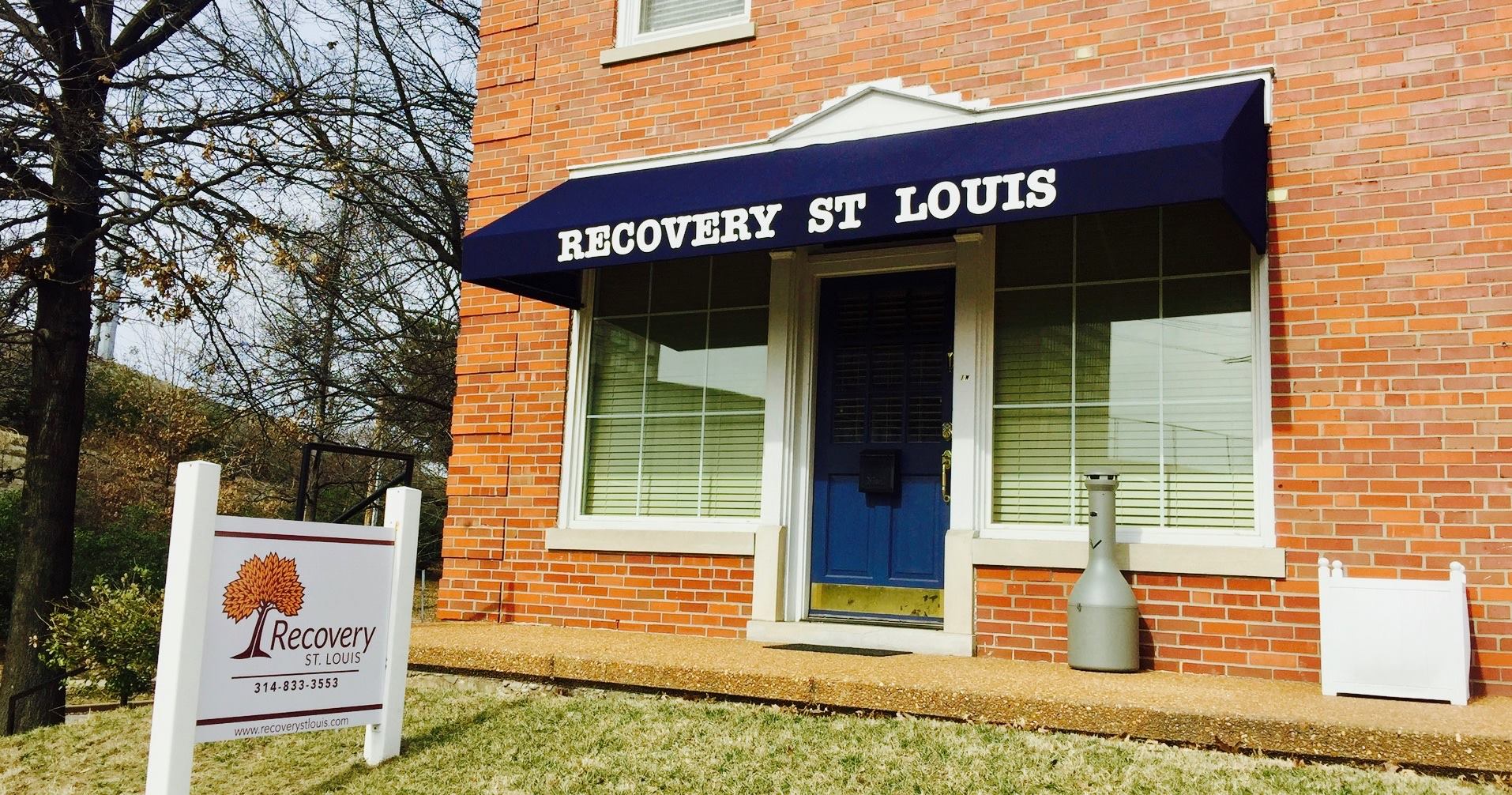 A blue awning on the front of a business.